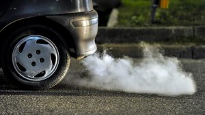 A vehicle releasing emissions